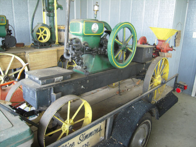 1921-22  1 1/2 hp  HERCULES  hit & miss  with bur mill and cart,