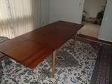 Danish Modern Dining Table 	

 Labeled made in Denmark. Faint water mark. Two leaves measure 21.5 each. Table 51X36X29. 	

	
http://auctionnearyou.maxsold.com/view-auctions/catalog/id/378/lot/40971/?url=%2Fview-auctions%2Fcatalog%2Fid%2F378%2F%3Fpage%3D1%26items%3D100
