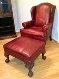 Bassett leather arm chair and matching ottoman