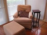 pair of beige club chairs with ottoman
