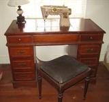 Singer sewing machine drops down in desk