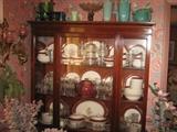Mahogany China Cabinet and set of 105 pieces of Royal Rajah Maroon Dishes & serving pieces; Pottery & carnival glass on top of the china cabinet.
