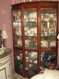 One of two, locking 6 ft tall, Mirror back, glass shelf, lighted, Vitrine cabinets. Full of Franciscan Desert Rose Dishes, and Depression Glass.