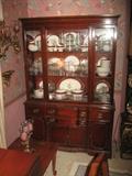 Mahogany China Cupboard and 105 pc. Set of Dishes.