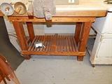 butcher block table has shelf and pot rack