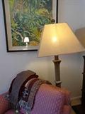 Natural curiosities art work, lamp and pink lounger.