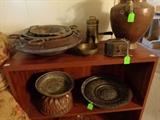 Teak book case, decorative cooper plates, bowls and boxes.  