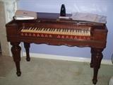 Antique Organ, the insides have been removed but the Rosewood, Legs and keys would be great to use for furniture repairs or Musical Instrument repair or construction. 