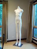 male & female statues, materials are metal inside with plaster of paris and plastic finishes