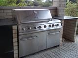 kenmore elite gas grill with burners and storage ready to roll away