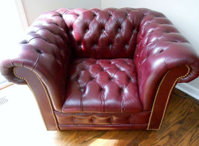 BURGUNDY LEATHER WITH NAIL HEAD TRIM TUFTED CHAIR WITH A MATCHING SOFA