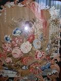 CLOSE UP OF THE FINE STITCHERY ON THE SCREEN, STUNNING