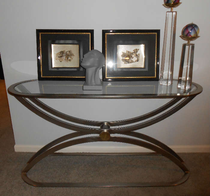 oval shaped beveled glass top and steel table deep discounts at only $200.00  other items in picture were sold.