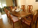 Perfect size dining room table with 6 chairs and two extensions, queen anne style each chair is done with nice fabric and lovely