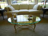 Living room furnishings in pristeen condition, sofa, wing back chairs, lamps, side tables, glass and brass coffee table enough to furnish your beautiful rooms.