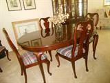 Thomasville dining room table with 6 chairs, two extensions and table pads, also --- a stunning china cabinet to match.