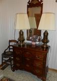 Foyer chest with matching mirror, not the brass lamps and one of a pair of matching antique chairs