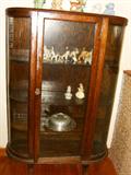Curved glass curio cabinet