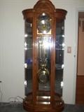 #17 Howard Miller Grandfather curio clock with curved glass