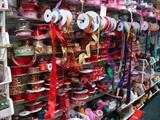 This photo speaks for itself. There are literally miles of ribbon. Many spools are unopened. Wholesale prices.