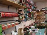 Gift wrap and gift wrapping ribbons abound. Many shopping bags, as well.