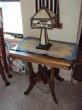 Eastlake style table and butterscotch slag leaded glass base and shade