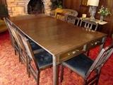 Fold-up dining table.  Closes into a small console table, chairs and leaves store inside.