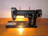 Vintage Necchi sewing machine in cabinet