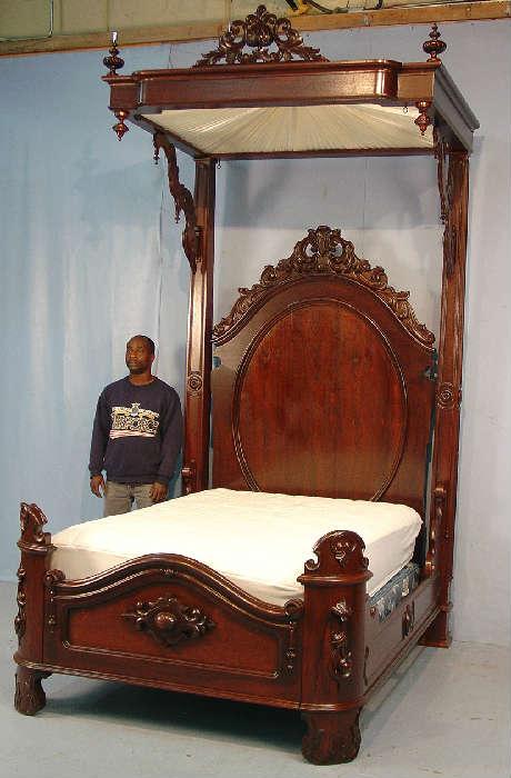 304 - Rosewood half tester bed in mint condition, att. To Mitchell and Rammelsberg, has original mosquito net hardware, 10ft 10in. T, 59in. W, 80in. L.