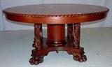 303- Acanthus carved mahogany banquet table with skirts and gadrooned leaves, 60in. Dia., 10 ft. L.