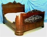 650 - Extremely ornate mahogany rococo oversized bed, piecec carved and rounded footboard, 71in. W, 7ft 1in. L, headboard is 62in. T, ca. 1850.