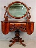 369- Mahogany empire vanity with swans on gadrooned top, 59in. T, 41in. W, 22in. D.