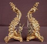 625 - Two highly detailed cherub figured gilt chenets each with musical instruments, ca. 1860, 16in. T.