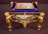 629 - Early 19th Century Sevres valuables casket, classically inspired figural plaques, champleve and bronze dore w cherubs, 5.5in. T, 9in. Sq. has been repaired.