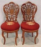 477- Pair of rosewood pierced carved side chairs with shield in back, needlepoint seats, laminated, 33in. T, 15in. W, 15in. D.