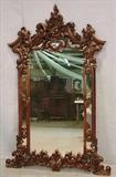 482 - Walnut Victorian hanging mirror with pierced carved crown, 53in. T, 36in. W.