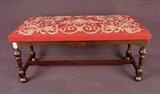 560 - Mahogany vanity bench with red needlepoint. 16in. T, 36in. W, 15in. D.
