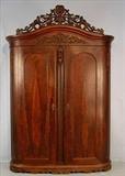 305- Mitchell and Rammelsberg wardrobe with heavily carved crown, 8ft. 7in. T, 66in. W, 20in. D, rounded corners.