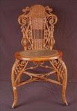 336 - Fancy original wicker photography chair att. To Heywood Wakefield, 32in. T, 17in. W, 15in. D.