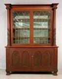 366- Mahogany empire revival breakfront with mirror back and acanthus columns, ca. 1870, 76in. T, 59in. W, 22in. D.