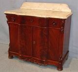 492 - Flame mahogany empire marble top wash stand, 34in. T, 37in. W, 19in. D, att to Mitchell and Rammelsberg.