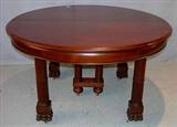 493 - Mahogany empire dining table with claw feet, double column center leg, ca. 1880, has three 22in. skirted leaves, 30in. T, 10ft L, 54in. W.