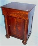 562 - Mahogany empire lift top commode with column front and bun feet, 32in. T, 23in. W, 18in. D.