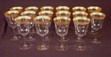413 - Set of 16 gold rim red wine glasses.