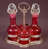 499 - Five piece cranberry cruet set.