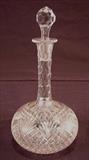 513 - Cut glass wine decanter with stopper, 9in. T. 3in. Stopper.