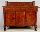 523 - Flame mahogany empire sideboard with rounded bottom door and acanthus carved feet, ca. 1840, 54in. T, 60in. W, 25in. D.