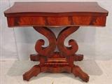 531 - Mahogany empire scroll base empire game table, 29in. T, 35in. W, 17in. D.