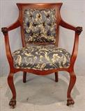 532 - Mahogany empire arm parlor chair with lion head on arms, blue and gold upholstery, ca. 1890, 33in. T, 24in. W, 24in. D.