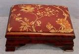 545 - Mahogany empire foot stool with maroon floral upholstery, 8in. T, 16in. W, 11in. D.